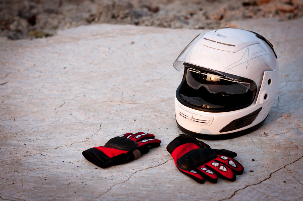Motorbike helmet and gloves.